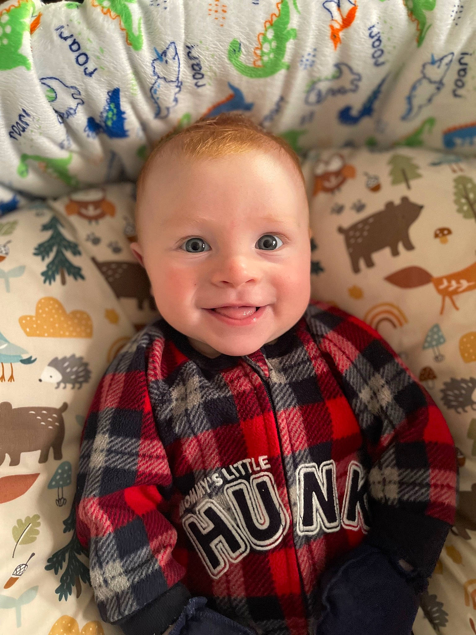 Blake is registered to the contest to win money with this photo: baby, baby_toddler_clothing, cheek, child, collar, eye, hair, happy, iris, pattern, person, plaid, sitting, skin, sleeve, smile, t_shirt, tartan, textile, toddler
