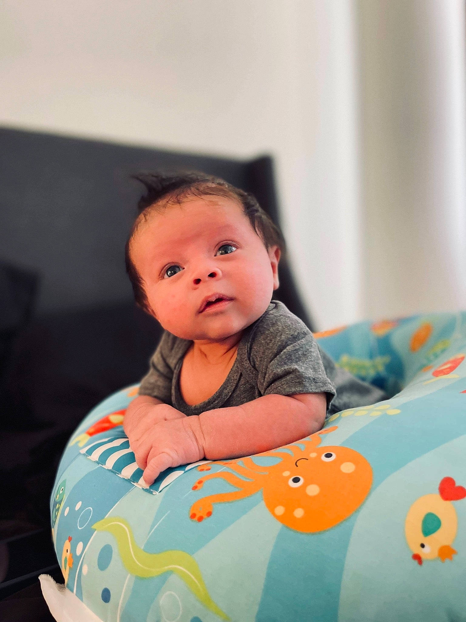 Jiraiya is registered to the contest to win money with this photo: baby, baby_products, baby_toddler_clothing, bib, cheek, child, comfort, dress, flash_photography, fun, happy, human_body, linens, person, portrait_photography, room, sitting, sleeve, t_shirt, toddler