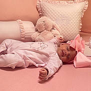 Ohana participe au concours pour gagner de l'argent avec cette photo : baby, sleeping, pink, bow, pajamas, bed, pillow, stuffed_animal, bunny, plush, soft, cozy, child, infant, cute, relaxing, indoors, rest, blanket, headband