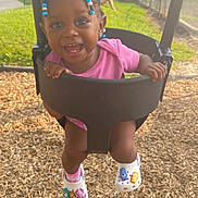 Xyahna joined the competition — help win amazing prizes! toddler, swing, playground, smiling, child, outdoor, grass, woodchips, pink_clothing, shoes, beads, hair, person, happy, summer, sunlight, park, play, fun, joy