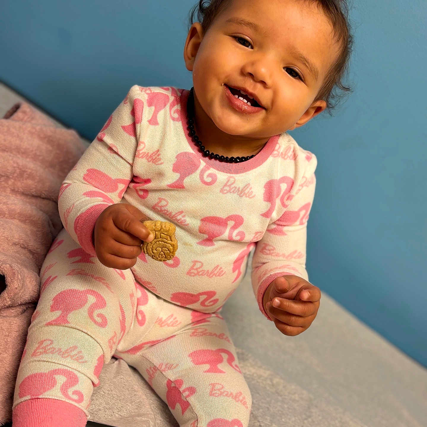 Meadow is registered to the contest to win money with this photo: baby, babylaughing, clothing, face, happy, head, laughing, pajamas, person, photography, portrait, sitting, sleeve, smile