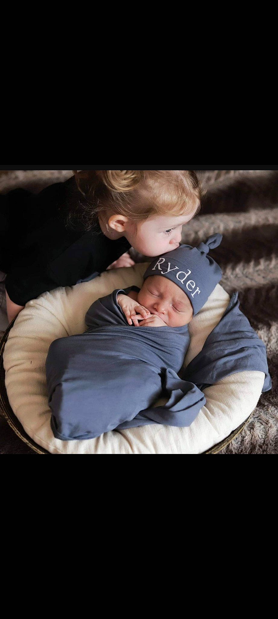Myla is registered to the contest to win money with this photo: baby, cheek, child, comfort, couch, darkness, flash_photography, fun, fur, gesture, grass, happy, headwear, hug, love, outerwear, person, portrait_photography, sitting, toddler