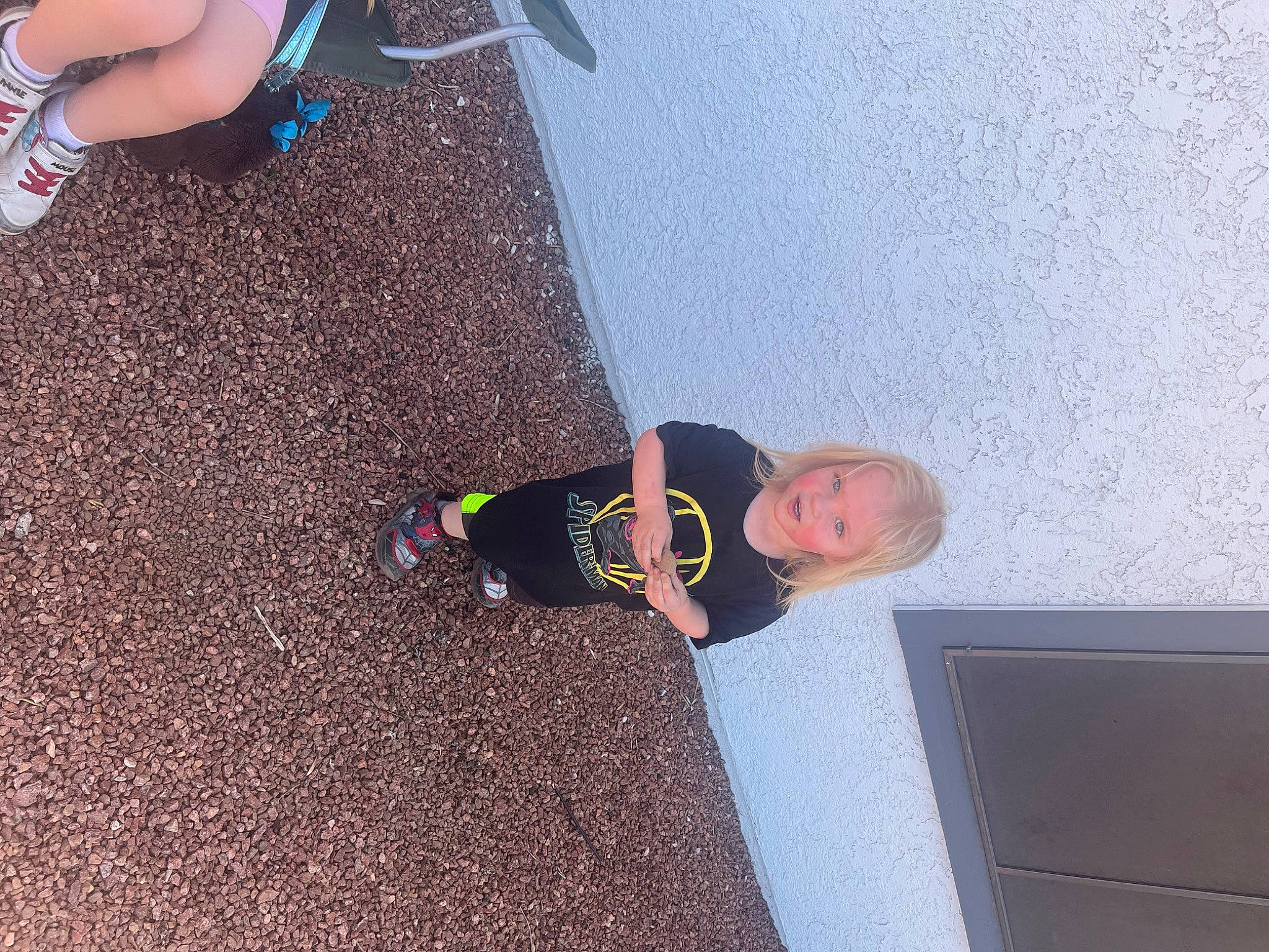 Jasper is registered to the contest to win money with this photo: asphalt, calf, child, concrete, floor, flooring, foot, fun, human_leg, knee, leg, person, road_surface, shadow, shoe, sneakers, t_shirt, thigh, toddler, walking_shoe