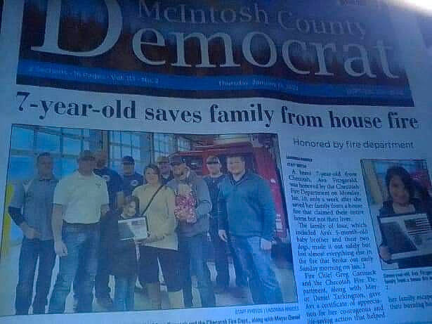 Ava is registered to the contest to win money with this photo: advertising, event, font, landscape, media, news, newspaper, newsprint, paper, paper_product, person, publication, sleeve, suit, under_exposed, world