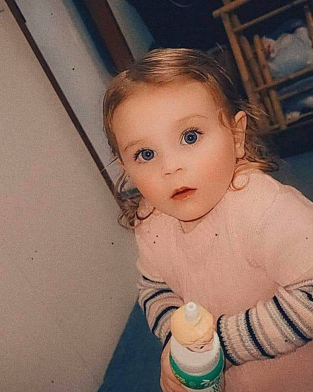 Lilah joined the competition — help win amazing prizes! baby, baby_bottle, baby_toddler_clothing, cheek, chin, cool, eye, eyebrow, eyelash, facial_expression, hairstyle, happy, iris, mouth, nose, person, plastic_bottle, skin, smile, standing