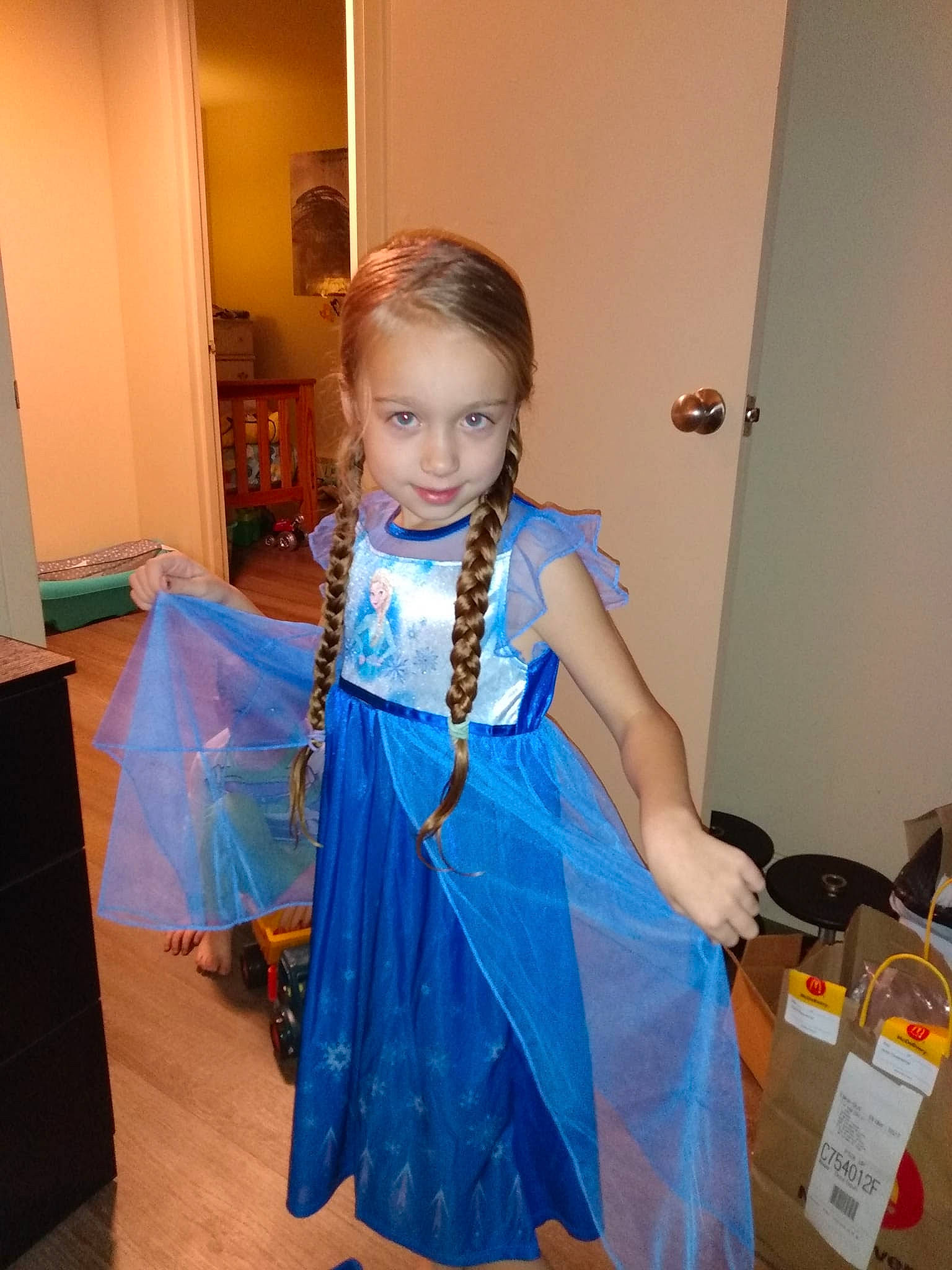 Blythe is registered to the contest to win money with this photo: bag, child, costume, door, dress, electric_blue, event, fashion_accessory, fashion_design, formal_wear, fun, happy, jewellery, joy, pattern, peach, person, room, sleeve, smile