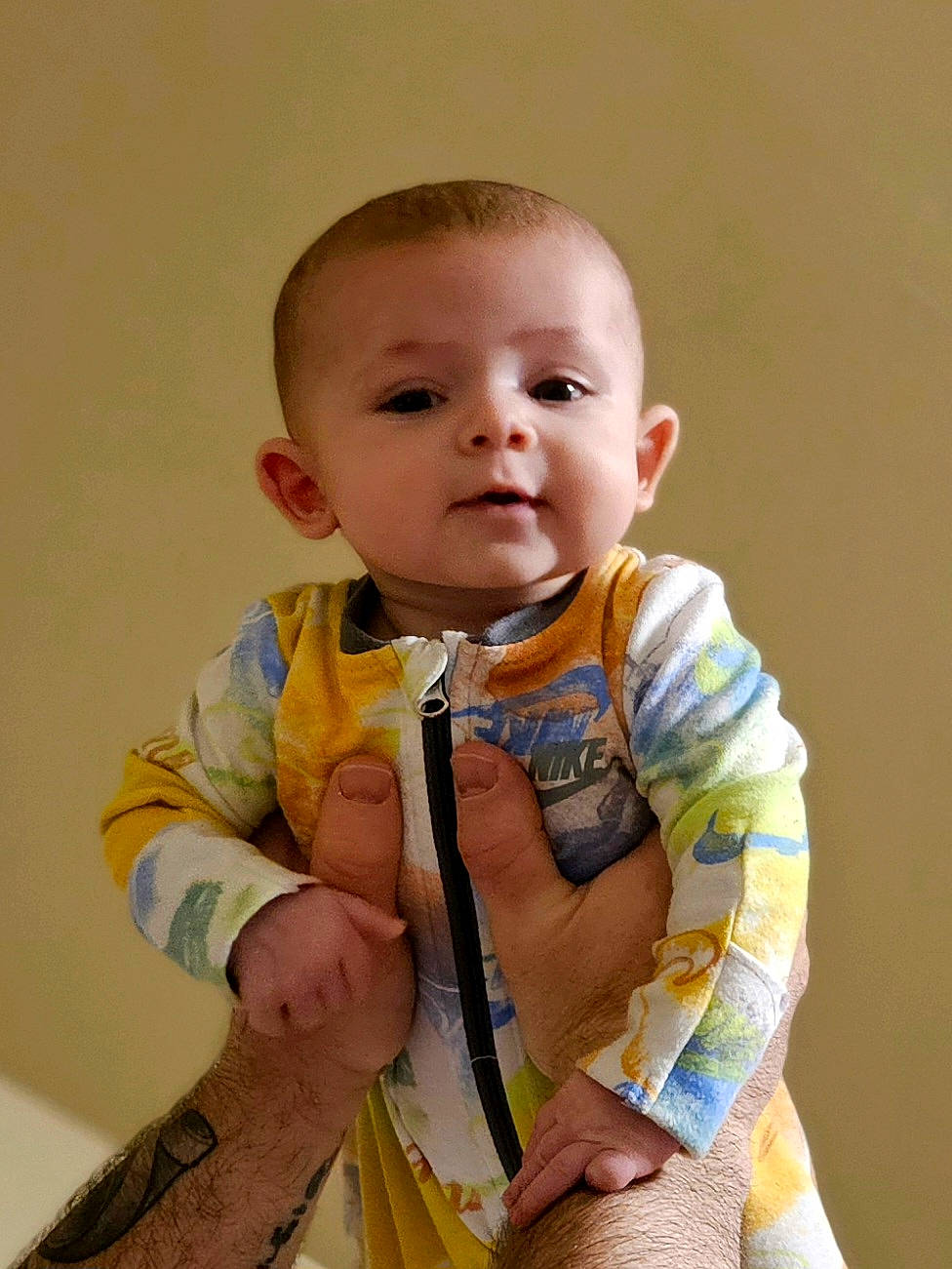 Sylas is registered to the contest to win money with this photo: baby, baby_toddler_clothing, cheek, child, chin, collar, dress_shirt, eye, happy, head, iris, neck, nose, pattern, person, sitting, skin, sleeve, t_shirt, thumb