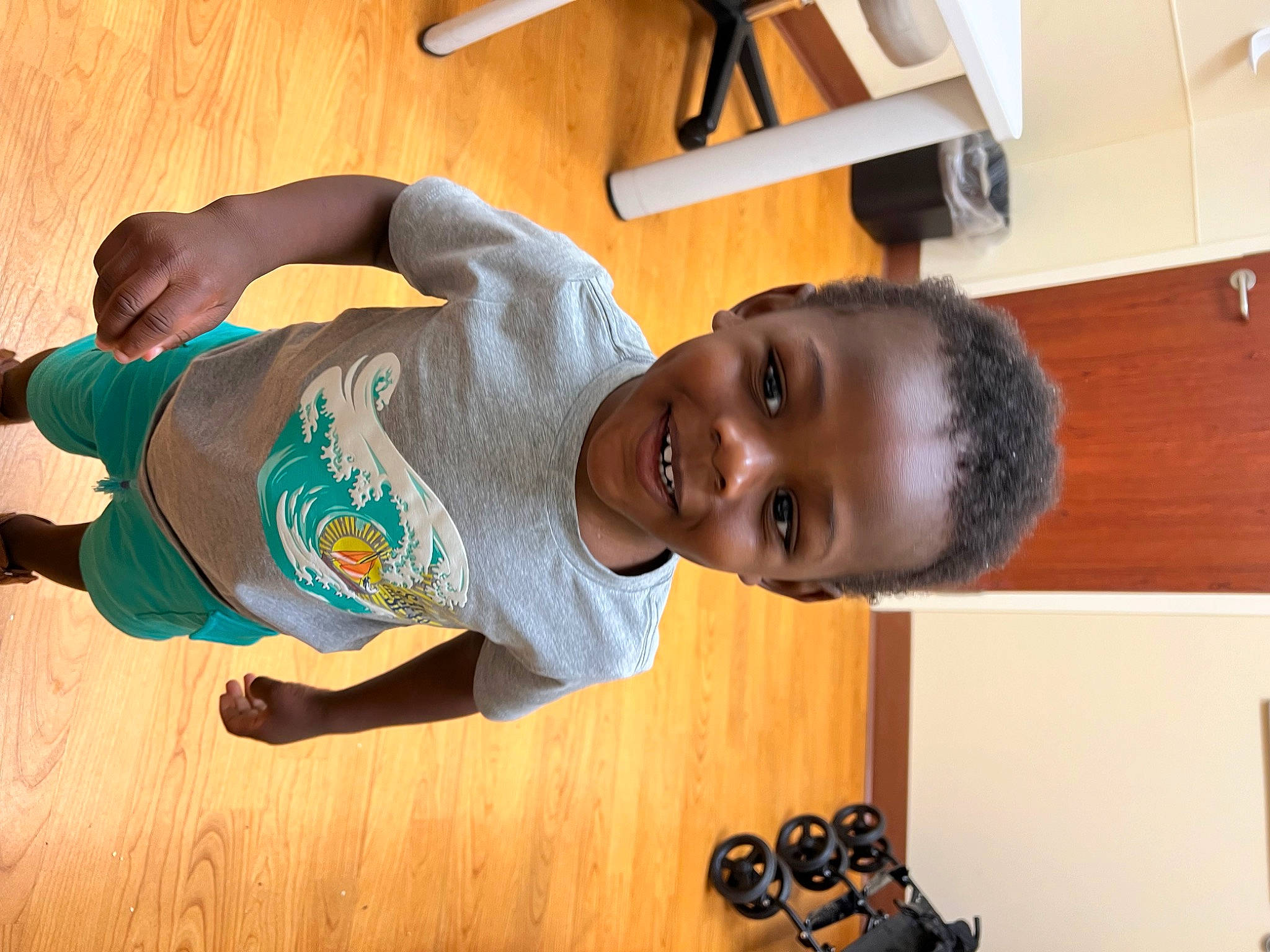 Benjamin joined the competition — help win amazing prizes! black, camera, child, elbow, flooring, fun, happy, hardwood, human_leg, joint, joy, knee, person, room, sitting, smile, t_shirt, toddler, wood, wood_flooring