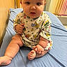 Jaycie joined the competition — help win amazing prizes! baby, child, infant, sitting, blue_sheet, space_theme_clothing, curious, indoor, chubby_cheeks, wide_eyes, colorful_curtains, cute, toddler, person, portrait, clothing, furniture, floor, skin, hand