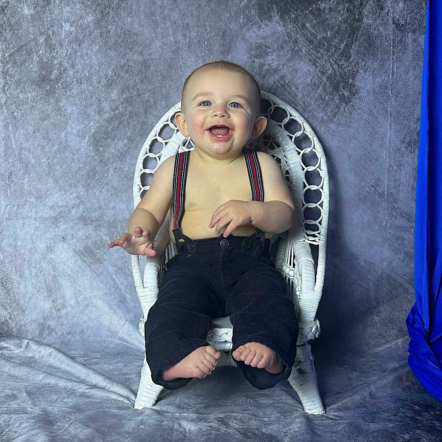Travis is registered to the contest to win money with this photo: baby, babylaughing, bodypart, chair, clothing, face, footwear, furniture, happy, head, hosiery, jeans, pants, person, photography, portrait, shoe, sitting, smile, sock