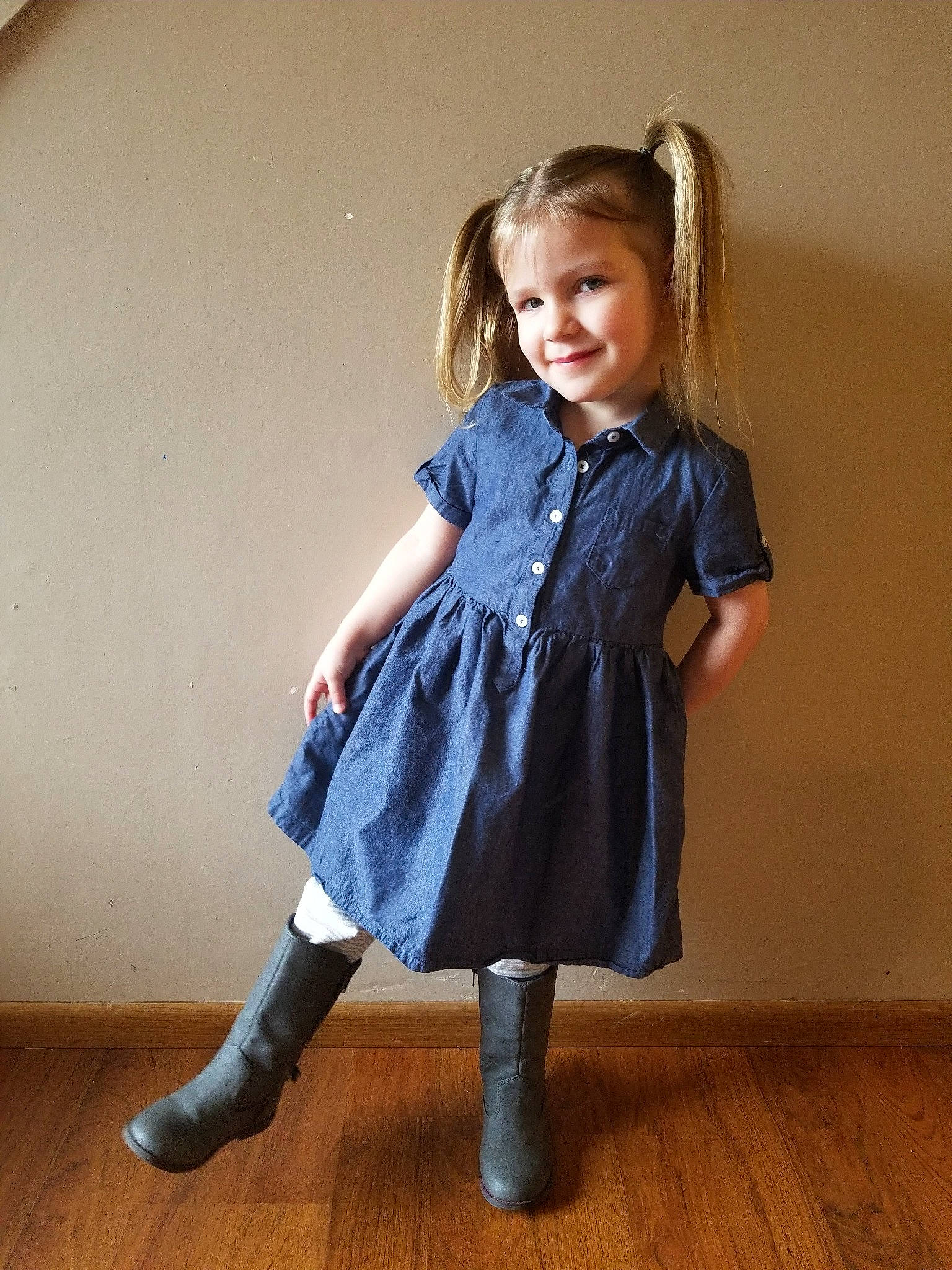 Colette is registered to the contest to win money with this photo: blue, child, child_model, clothing, denim, dress, footwear, jeans, joint, joy, knee, leggings, outerwear, pattern, person, shoe, sleeve, standing, textile, tights
