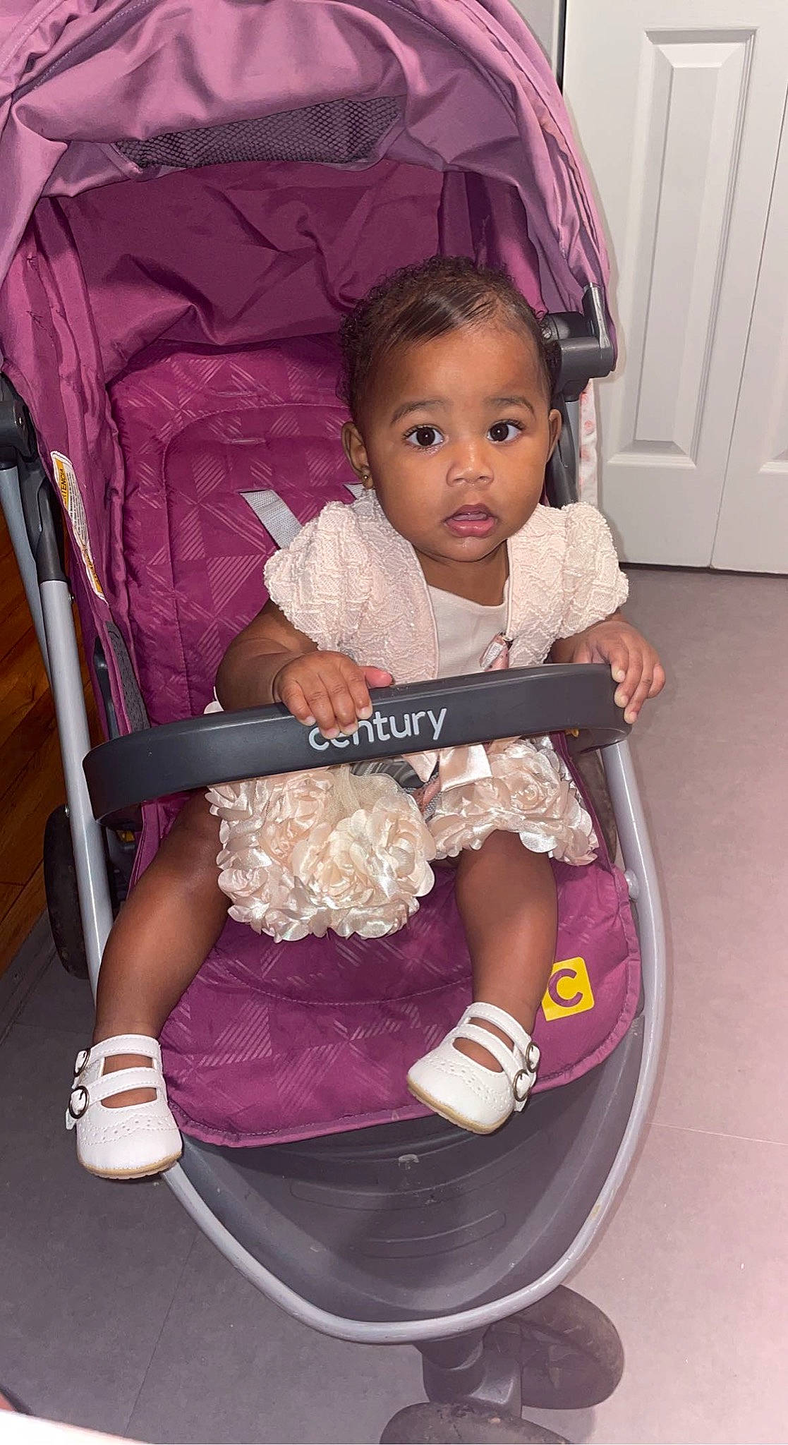 Jayla is registered to the contest to win money with this photo: baby, baby_carriage, baby_products, baby_toddler_clothing, beauty, chair, cheek, child, comfort, door, fun, happy, iris, magenta, person, pink, product, purple, sitting, toddler