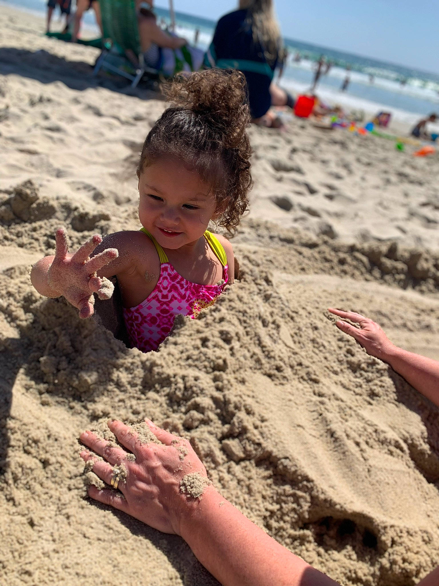 Dianna is registered to the contest to win money with this photo: beach, child, fun, joy, mud, person, play, recreation, sand, smile, soil, summer, vacation