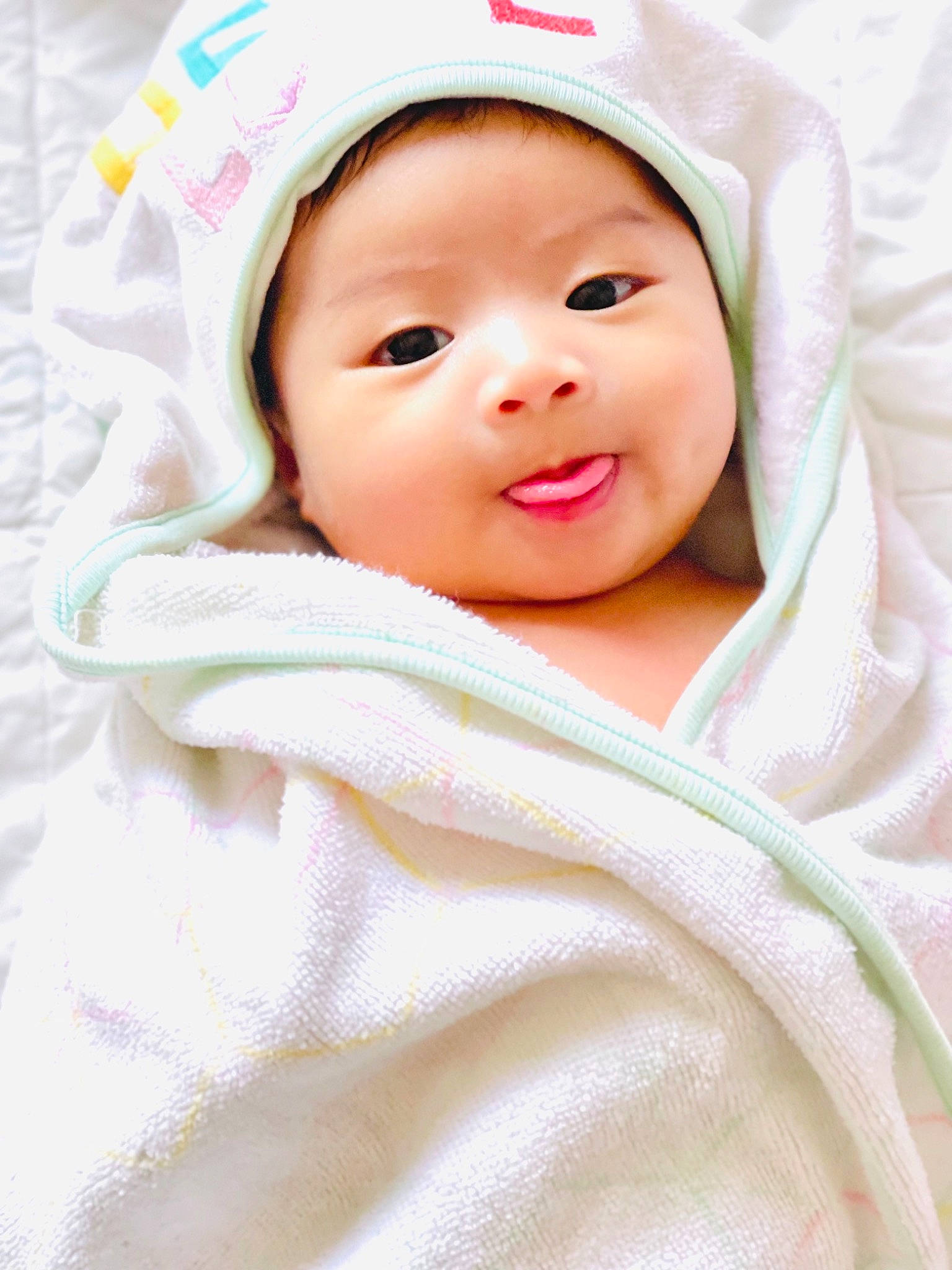 Keziah is registered to the contest to win money with this photo: baby, baby_products, baby_toddler_clothing, cap, cheek, child, chin, comfort, eyebrow, fashion_accessory, happy, headwear, hood, linens, lip, person, portrait_photography, skin, sleeve, smile