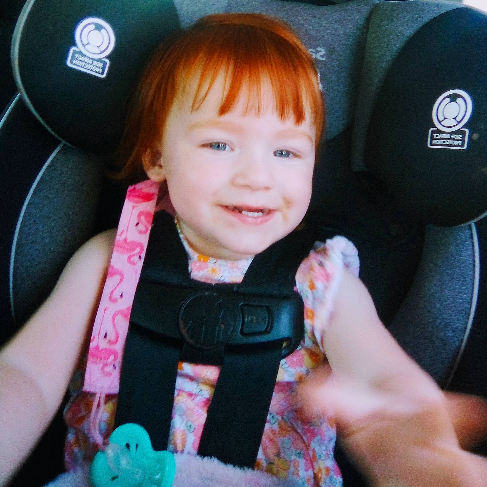 Emma is registered to the contest to win money with this photo: auto_part, baby, baby_in_car_seat, baby_toddler_clothing, blue, car_seat, cheek, child, comfort, cool, electric_blue, finger, happy, head_restraint, joy, person, product, seat_belt, skin, smile