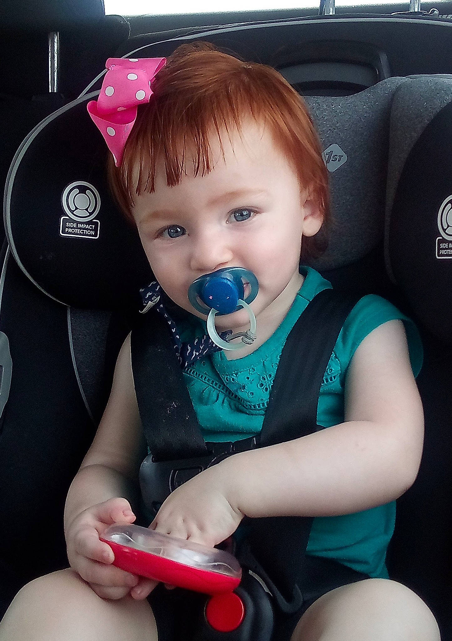 Emma joined the competition — help win amazing prizes! arm, auto_part, baby, baby_products, baby_toddler_clothing, car_seat, child, finger, hair, hand, happy, human_body, nail, person, product, sitting, skin, sleeve, steering_wheel, toddler