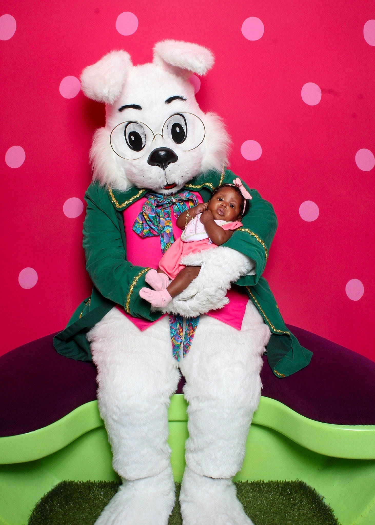 Jayani is registered to the contest to win money with this photo: child, christmas, costume_hat, event, fictional_character, font, fun, fur, happy, hat, holiday, lap, magenta, mascot, pattern, person, pink, recreation, smile, thigh