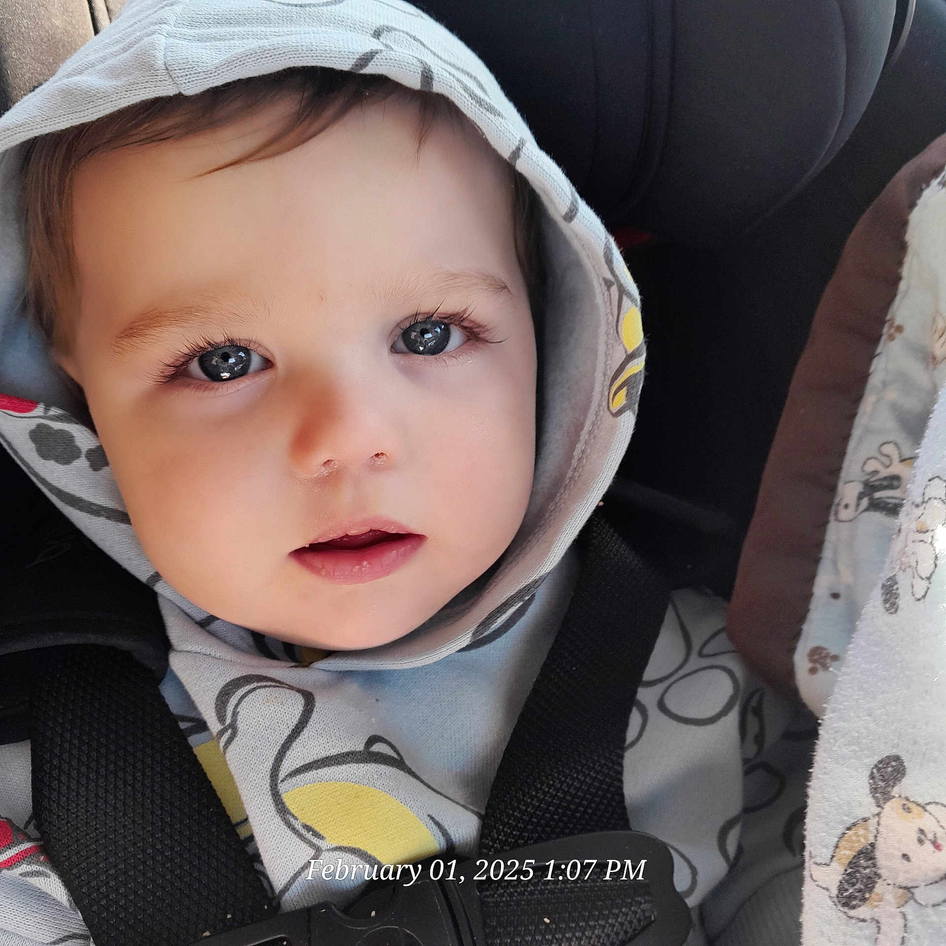 Kennith is registered to the contest to win money with this photo: baby, bonnet, car, car_interior, carseat, clothing, coat, face, hat, head, hood, hoodie, knitwear, person, photography, portrait, sweater, sweatshirt, transportation, vehicle