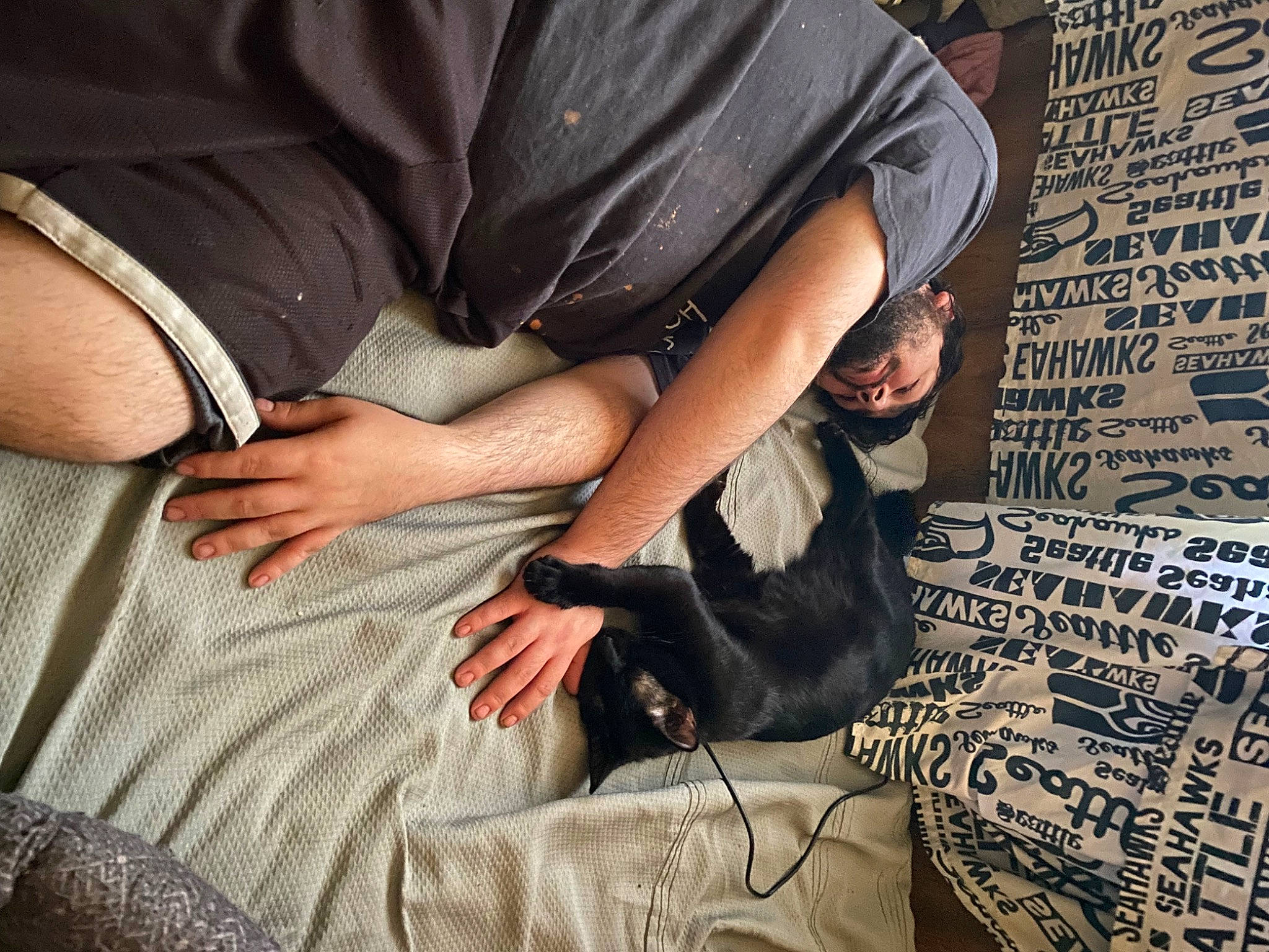 Charlie Bear is registered to the contest to win money with this photo: abdomen, child, comfort, denim, elbow, eyewear, flooring, fur, gesture, human, human_leg, knee, nail, pattern, sitting, t_shirt, textile, thigh, wood, wrist