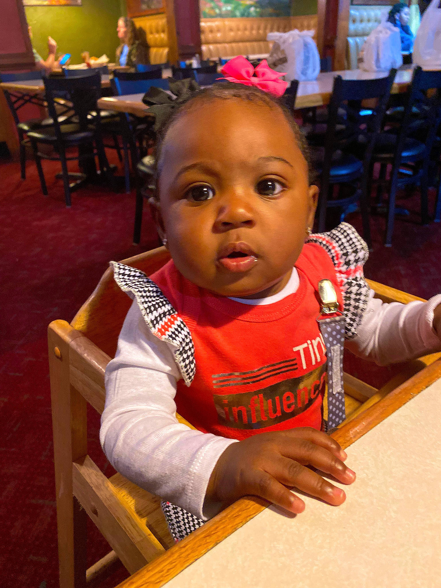 Kahlani is registered to the contest to win money with this photo: baby, chair, cheek, child, chin, event, flooring, fun, furniture, happy, leisure, person, room, sitting, skin, t_shirt, table, toddler, tradition, vacation