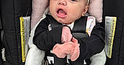 Raelyn joined the competition — help win amazing prizes! baby, black_clothing, blanket, car_seat, child, close_up, cute, harness, headband, indoor, infant, mittens, person, pink_mittens, portrait, red_button, safety, seat_belt, sitting, young_child