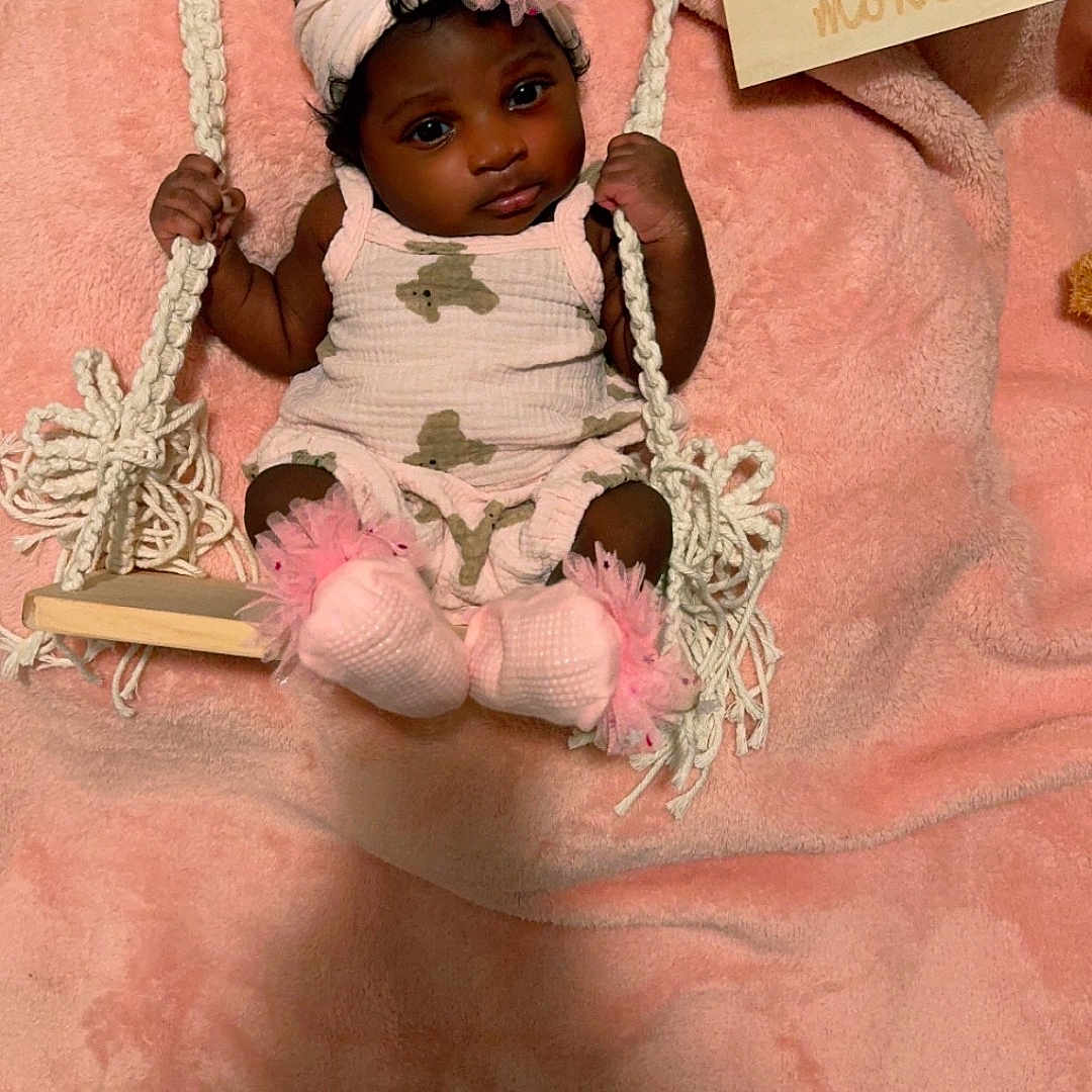 Nova joined the competition — help win amazing prizes! accessories, baby, bed, bonnet, clothing, dress, face, footwear, furniture, hat, head, jewelry, necklace, newborn, person, photography, portrait, shoe, sitting, toy