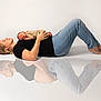 baby, barefoot, black_shirt, child, family, intimate, jeans, lying_down, minimalist, mother, newborn, peaceful, portrait, pregnancy, reflection, sleeping, soft_lighting, studio, white_background, woman
