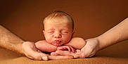 Gabriel a rejoint le concours — aidez-le/la à gagner de superbes lots ! newborn, baby, infant, hands, sleeping, peaceful, soft, skin, portrait, closeup, resting, puckered_lips, adult_hands, brown_background, tender, warm, cute, child, human, face