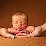 newborn, baby, infant, hands, sleeping, peaceful, soft, skin, portrait, closeup, resting, puckered_lips, adult_hands, brown_background, tender, warm, cute, child, human, face