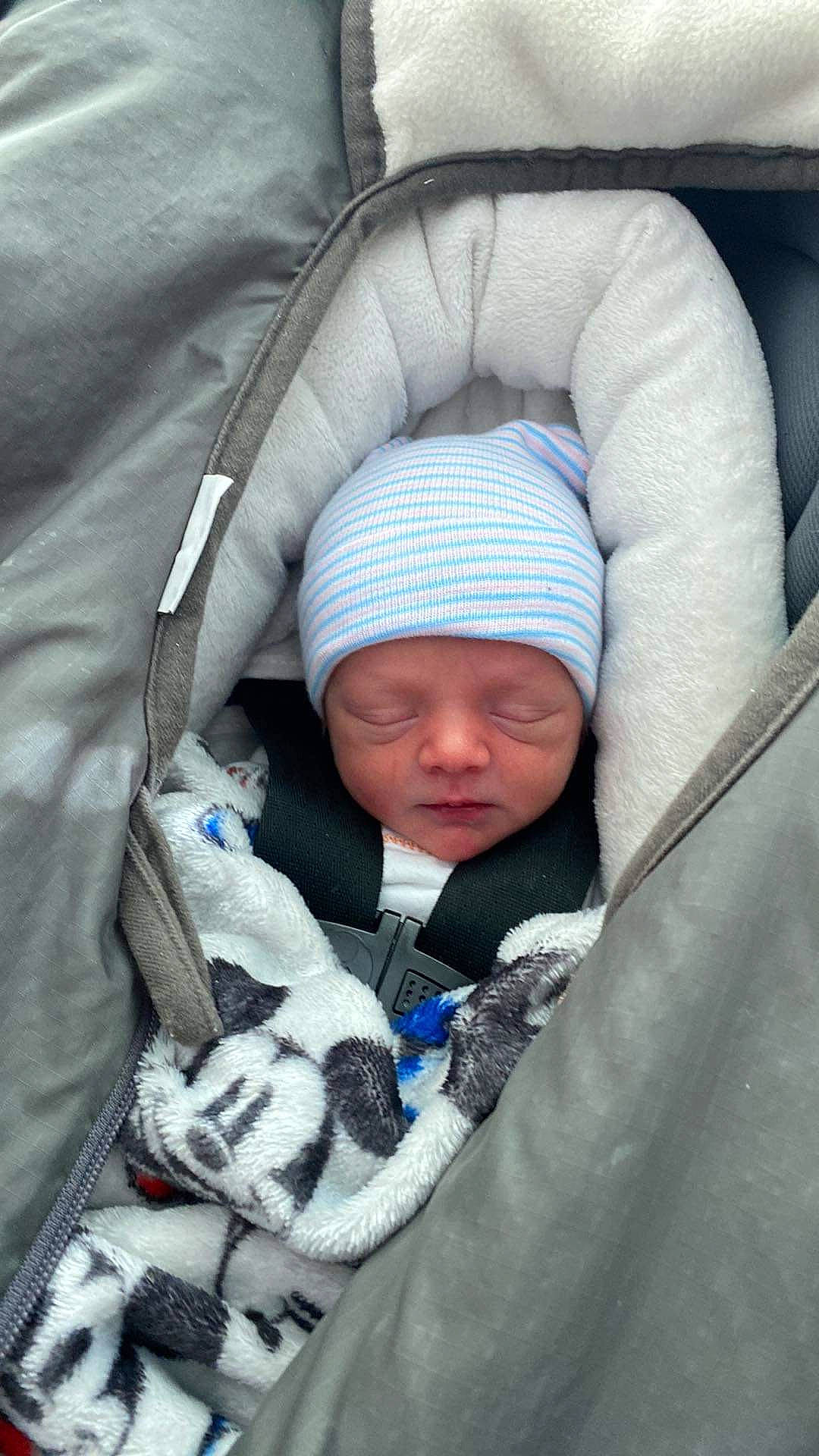 Zaelyn joined the competition — help win amazing prizes! baby, baby_products, baby_toddler_clothing, car_seat, child, comfort, electric_blue, face, fur, headwear, linens, person, product, sitting, sleep, toddler, winter