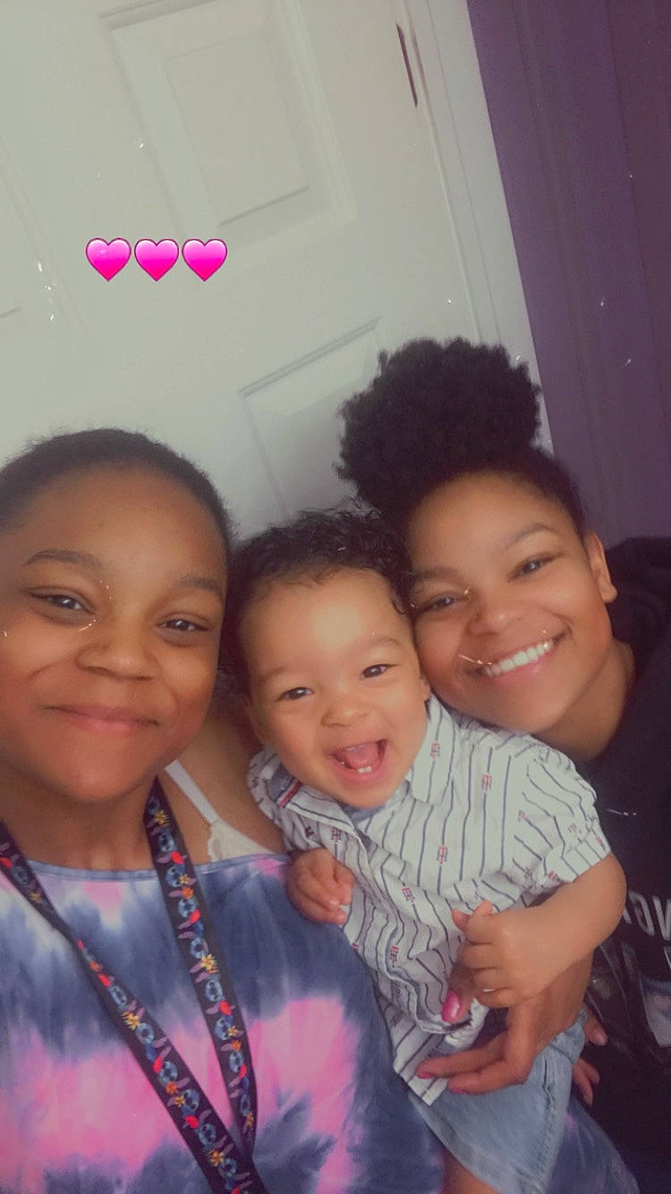 Jeremiah is registered to the contest to win money with this photo: cheek, child, event, eyebrow, face, facial_expression, friendship, fun, gesture, happy, head, iris, joy, magenta, person, pink, sharing, skin, smile, t_shirt