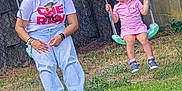 Nora a rejoint le concours — aidez-le/la à gagner de superbes lots ! child, woman, swing, playground, grass, flowers, tree, fence, cap, glasses, pink_clothing, casual_wear, outdoor, smiling, happy, nature, daylight, fun, leisure, person