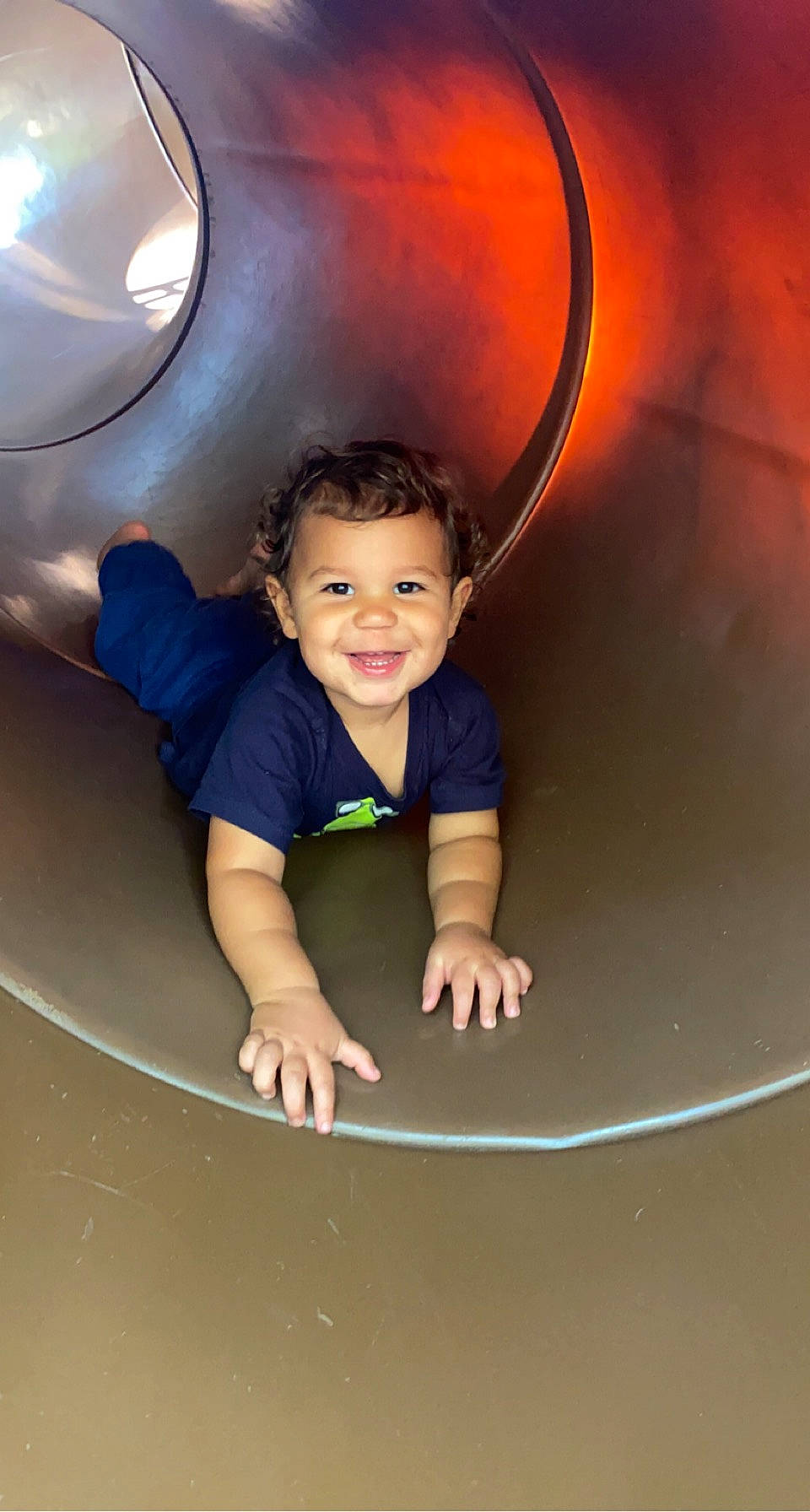 Leo James is registered to the contest to win money with this photo: arm, automotive_design, automotive_exterior, automotive_tire, baby_toddler_clothing, bumper, child, circle, eye, flash_photography, fun, hair, hairstyle, happy, joy, leisure, person, recreation, smile, t_shirt