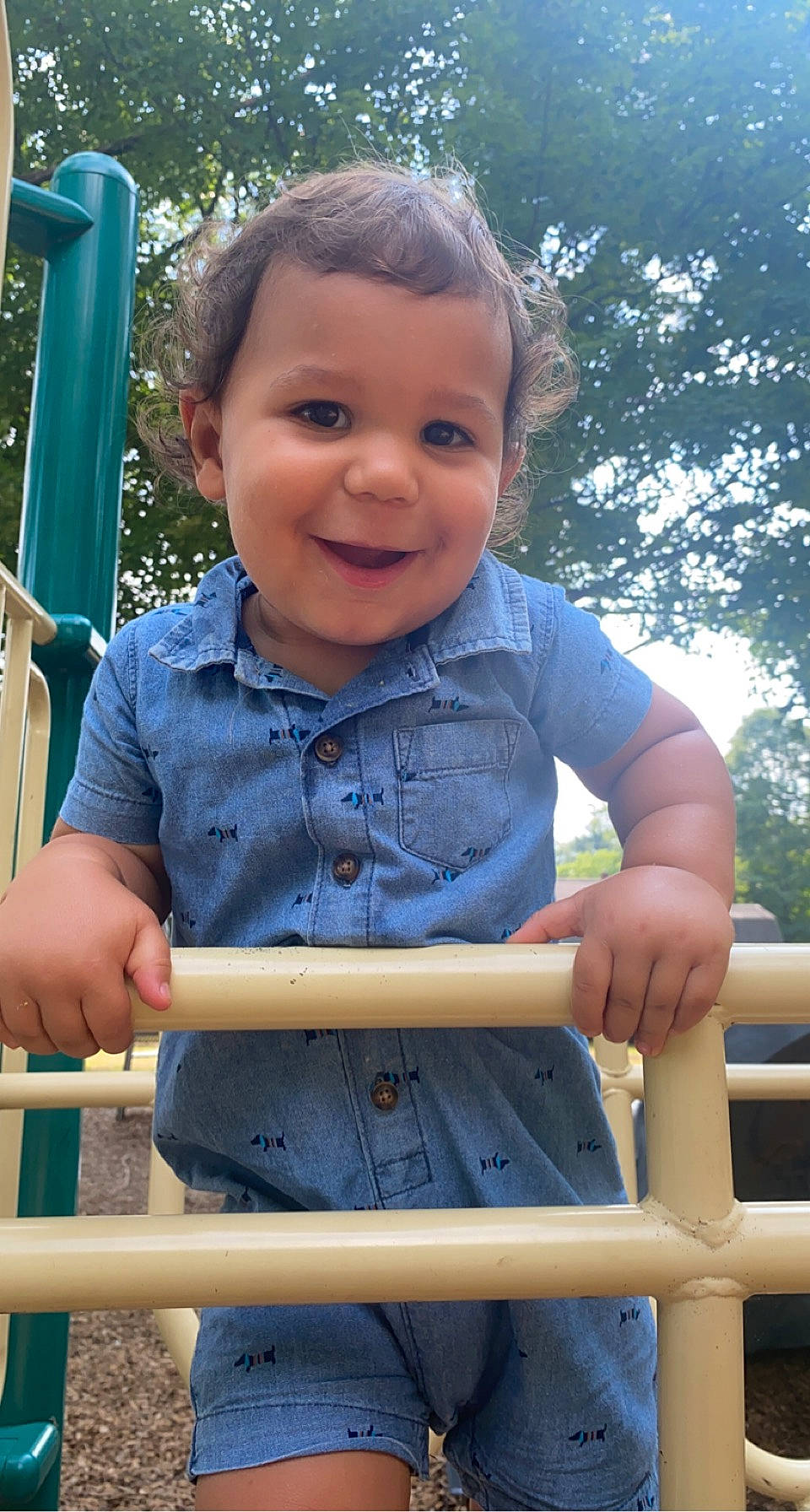 Leo James joined the competition — help win amazing prizes! baby_toddler_clothing, chin, facial_expression, fun, grass, hand, happy, joy, leisure, person, playground, recreation, skin, sleeve, smile, standing, summer, swing, t_shirt, toddler