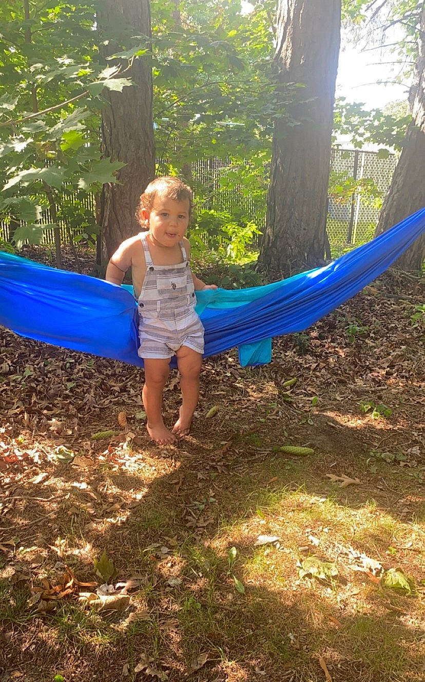 Leo James is registered to the contest to win money with this photo: camping, electric_blue, fun, grass, happy, leisure, light, nature, outdoor_recreation, people_in_nature, person, plant, recreation, shade, sunlight, terrestrial_plant, tints_and_shades, toddler, tree, woody_plant