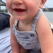Slater joined the competition — help win amazing prizes! baby, child, smiling, close_up, romper, blue_eyes, skin, arm, hand, outdoor, water, background_blur, happy, infant, cute, person, portrait, clothing, head, face