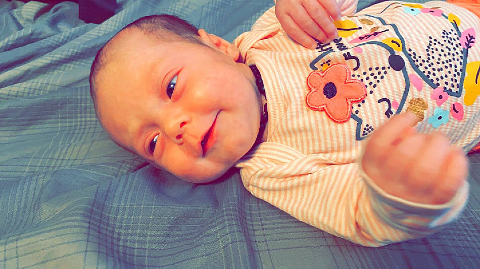 Harlyn is registered to the contest to win money with this photo: baby, bedtime, cheek, child, ear, eye, face, forehead, hand, head, lip, mouth, nose, person, pink, skin, smile, toddler