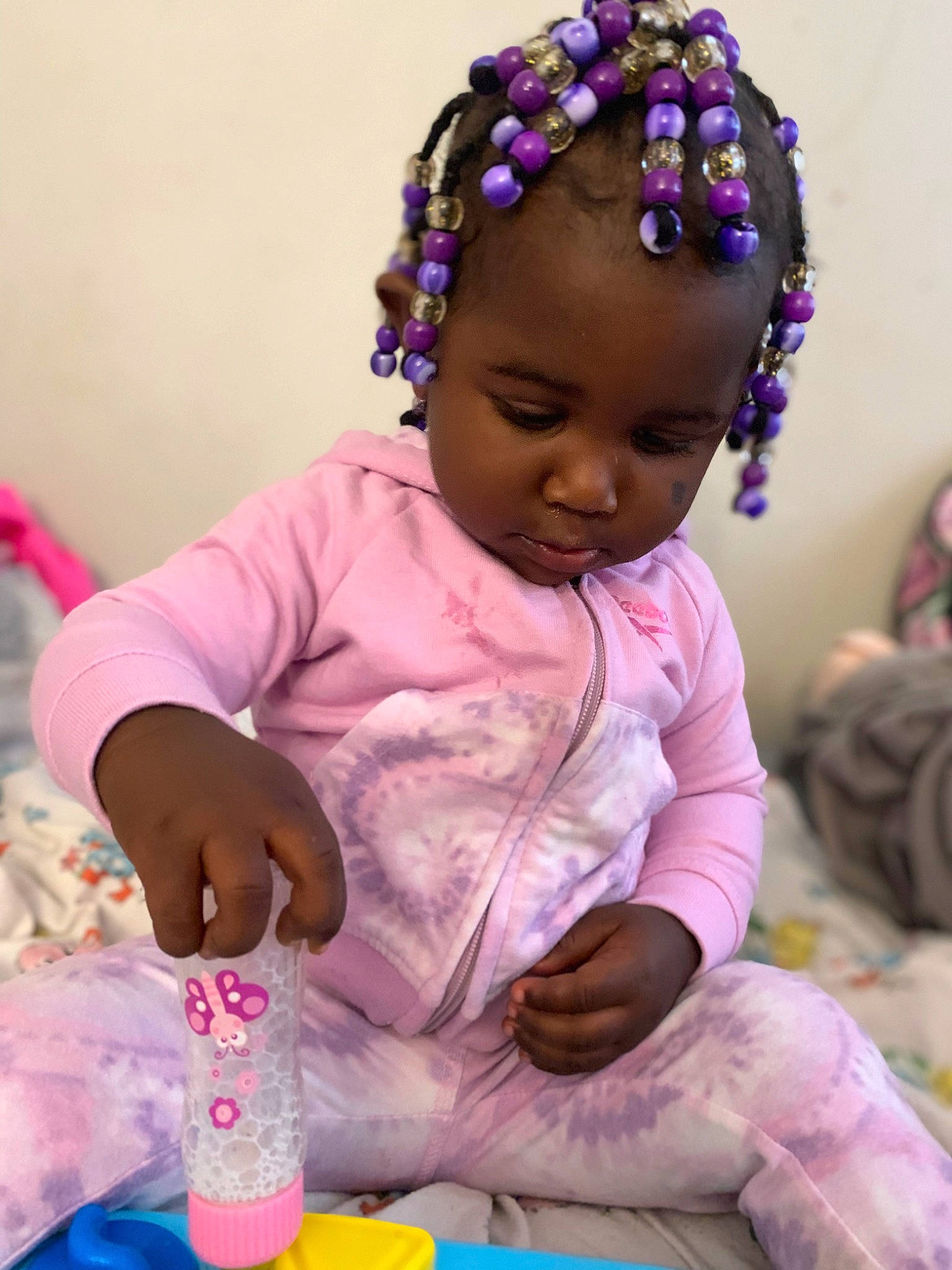 Araya is registered to the contest to win money with this photo: art, baby, baby_playing_with_toys, baby_toddler_clothing, cheek, child, event, fun, happy, head, headgear, magenta, people, person, pink, purple, skin, textile, toddler, violet