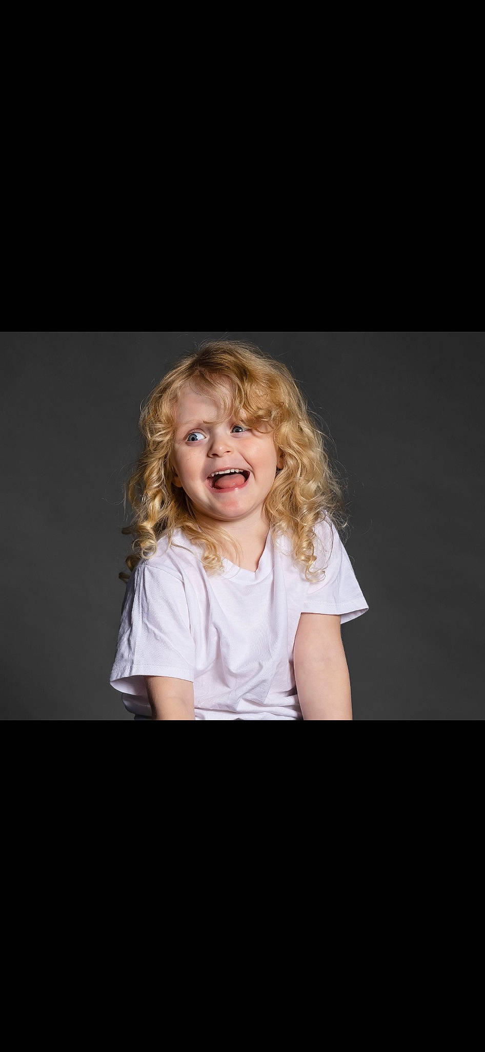 Journee joined the competition — help win amazing prizes! brown_hair, cheek, child, child_model, darkness, elbow, flash_photography, fun, gesture, happy, joy, laugh, layered_hair, person, portrait, portrait_photography, sitting, sleeve, smile, step_cutting