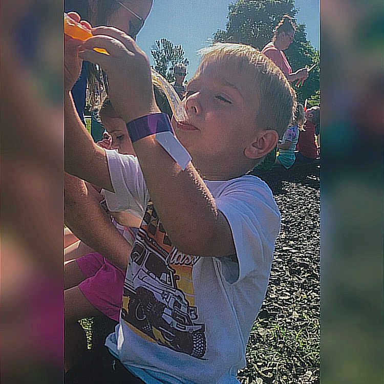 Conner is registered to the contest to win money with this photo: accessories, baseballcap, bodypart, boy, cap, child, clothing, face, finger, glasses, grass, hand, hat, head, male, people, person, photography, portrait, t_shirt