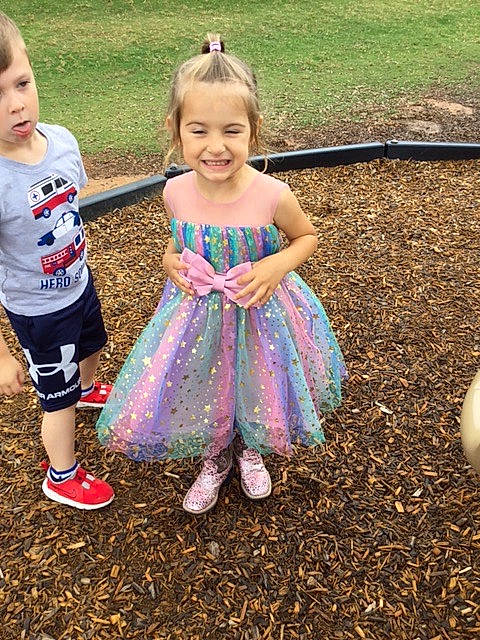 Sage is registered to the contest to win money with this photo: baby_toddler_clothing, child, event, fun, grass, grass_family, happy, human_body, joy, landscape, lawn, leisure, natural_environment, people_in_nature, person, pink, play, recreation, smile, soil