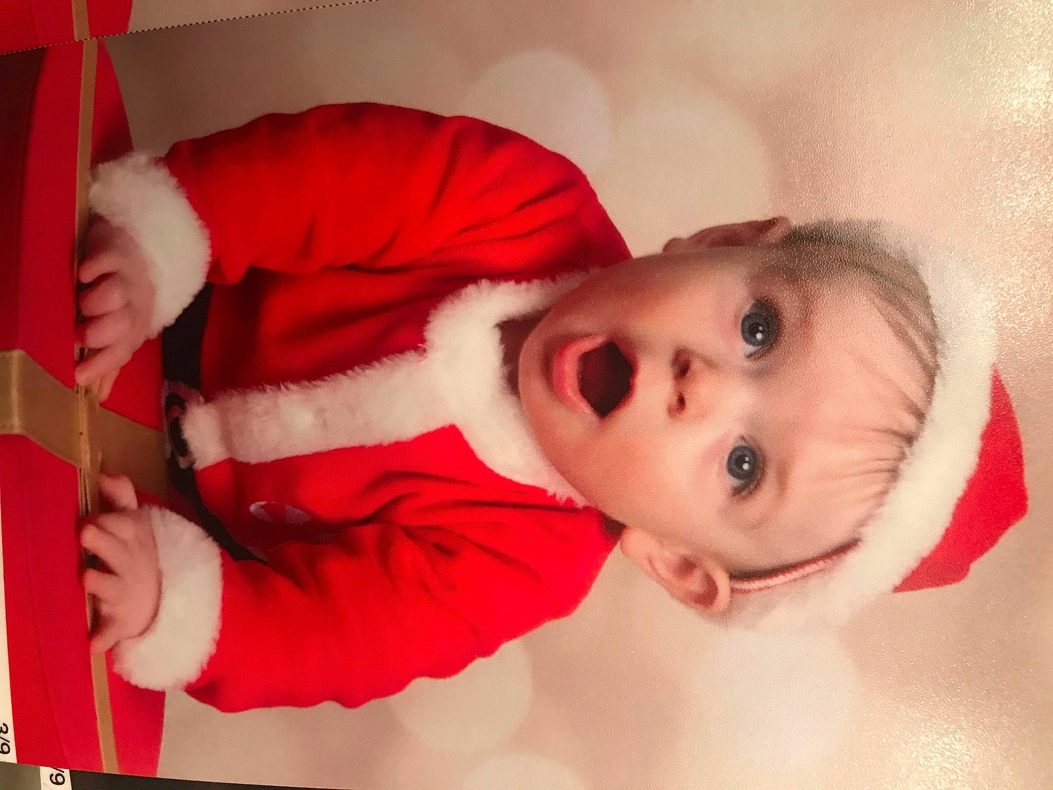 Cam is registered to the contest to win money with this photo: baby, baby_toddler_clothing, carmine, cheek, child, comfort, elbow, eyelash, fur, gesture, happy, hat, human_body, lip, mouth, nose, person, room, sleeve, surprise