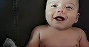 Jordin is registered to the contest to win money with this photo: baby, smiling, diaper, blanket, couch, leather, infant, child, happy, sitting, cute, portrait, skin, indoors, one_person, young_child, toddler, expression, comfort, relaxation