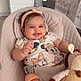 baby, baby_seat, bedroom, child, clothing, comfort, cute, furniture, giraffe, happy, headband, indoors, infant, person, plush_toy, seat_belt, smiling, soft_toy, toddler, toy