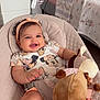 Malak participe au concours pour gagner de l'argent avec cette photo : baby, baby_seat, bed, bedroom, blanket, child, clothing, cute, furniture, giraffe, happy, headband, indoors, infant, lamp, person, pillow, plush_toy, smiling, tablet