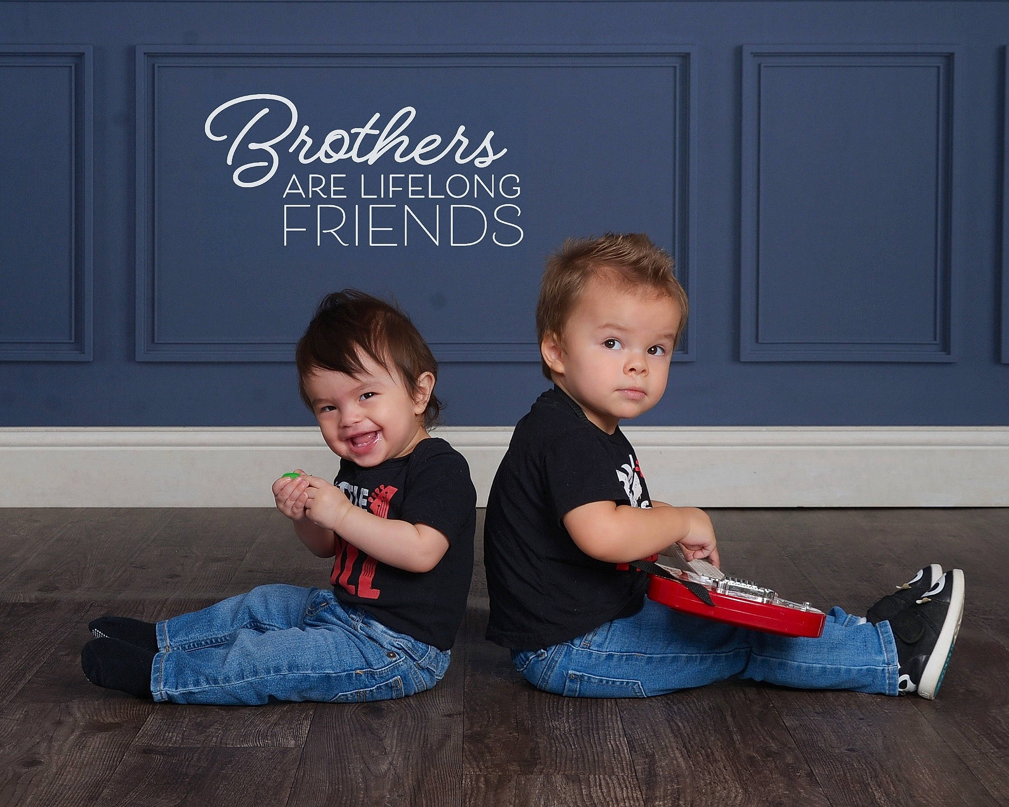 Oscar is registered to the contest to win money with this photo: baby_toddler_clothing, black, child, door, floor, flooring, fun, happy, hardwood, jeans, joy, leisure, person, shoe, sitting, sleeve, smile, sneakers, standing, t_shirt