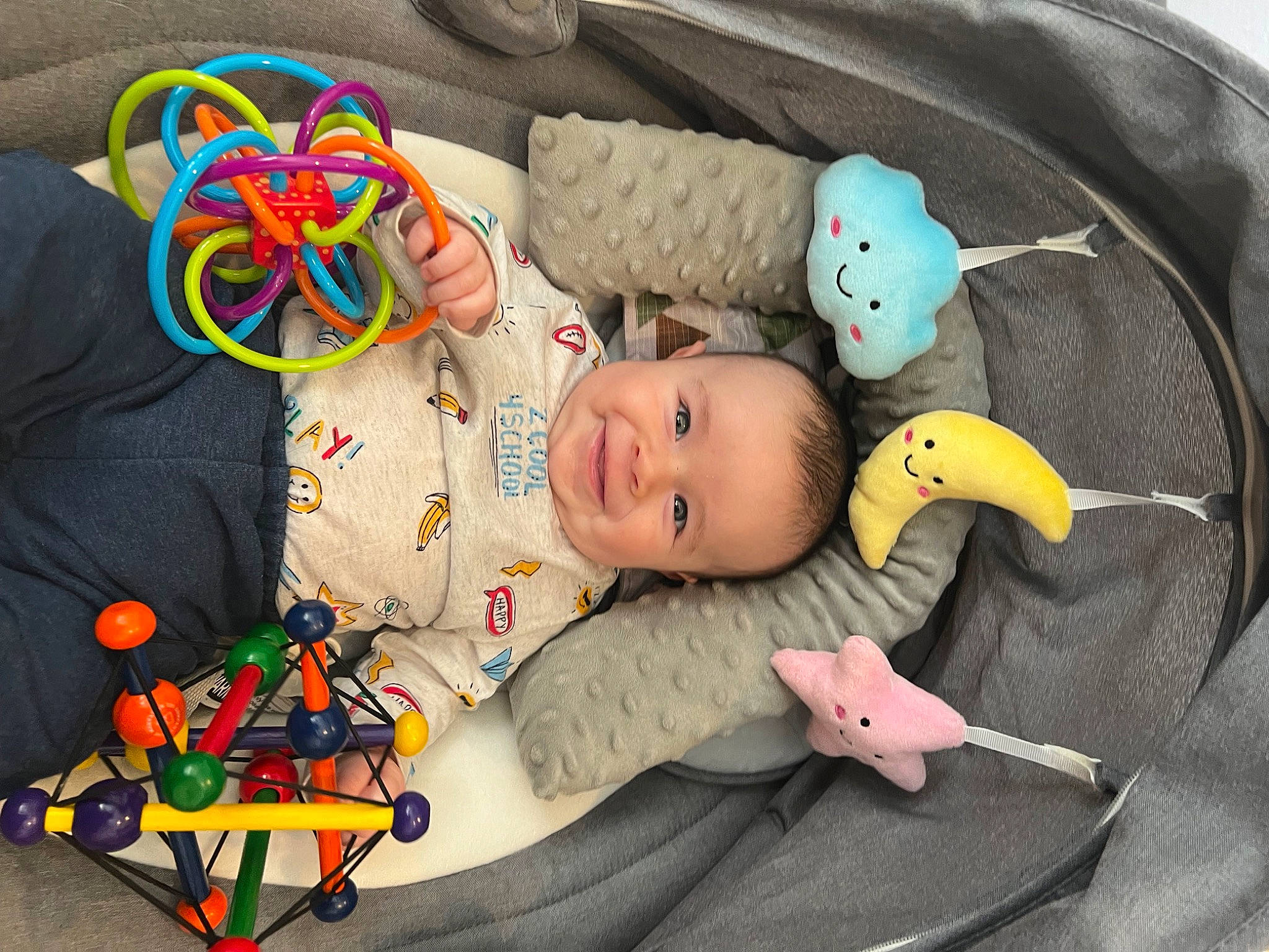 Braxton is registered to the contest to win money with this photo: baby, baby_products, baby_toddler_clothing, baby_toys, cheek, child, comfort, facial_expression, fun, happy, joy, linens, orange, person, play, room, smile, stuffed_toy, textile, toddler