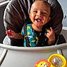 Silas joined the competition — help win amazing prizes! baby, child, high_chair, smiling, laughing, thumbs_up, portrait, indoor, kitchen, toy, rattle, lion_toy, infant, seated, harness, colorful, happy, face, window, daylight