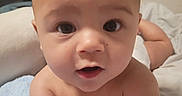 Ivan is registered to the contest to win money with this photo: arm, baby, bed, bedding, blanket, blue_blanket, child, cute, expression, eyes, face, hands, indoor, infant, mouth, person, portrait, skin, torso, young_child
