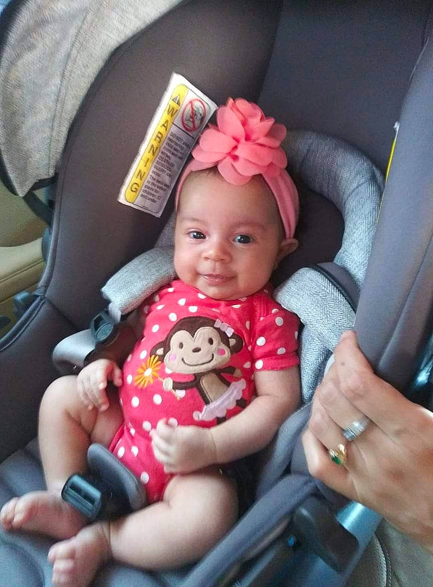 Mercy joined the competition — help win amazing prizes! arm, baby_carriage, baby_toddler_clothing, car_seat, cheek, comfort, eye, finger, gesture, hand, head, headwear, leg, lip, mouth, person, pink, skin, smile, textile